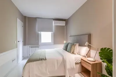Cama o camas de una habitación en Apartamento Embajadores VII