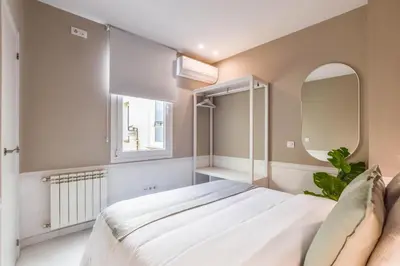 Cama o camas de una habitación en Apartamento Embajadores VII