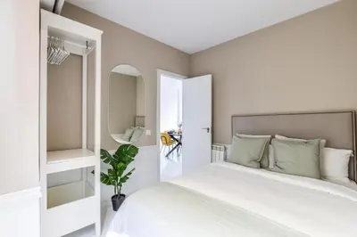 Cama o camas de una habitación en Apartamento Embajadores VI