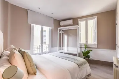 Cama o camas de una habitación en Apartamento Embajadores VIII