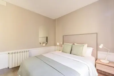 Cama o camas de una habitación en Apartamento Embajadores VIII