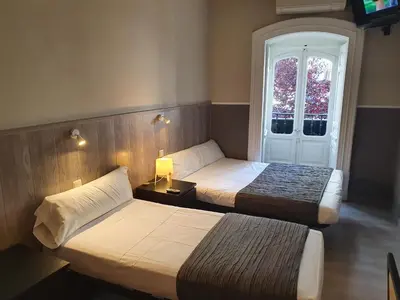 Cama o camas de una habitación en Plaza Dort Rooms IV