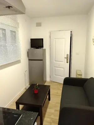 Una televisión o centro de entretenimiento en Apartamento A