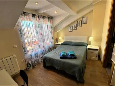Cama o camas de una habitación en Rooms San Marcos