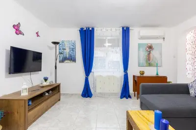Una televisión o centro de entretenimiento en Apartamento Casa de Campo - Alojamiento de temporada