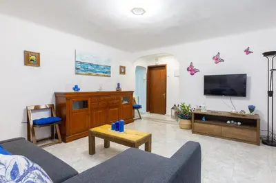 Una televisión o centro de entretenimiento en Apartamento Casa de Campo - Alojamiento de temporada