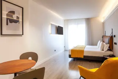 Cama o camas de una habitación en Suites Viena Plaza de España