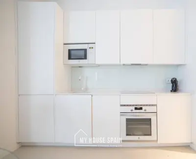 Una cocina o zona de cocina en MyHouseSpain - Nuevo apartamento junto al Bernabéu