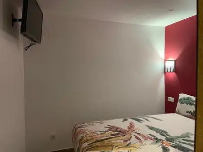 Cama o camas de una habitación en Corazón de gran vía infantas 7