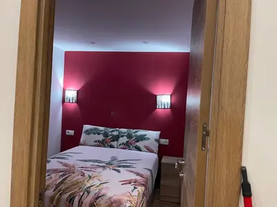 Cama o camas de una habitación en Corazón de gran vía infantas 7