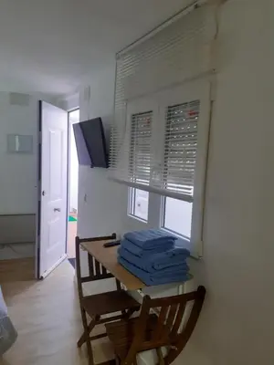 Una televisión o centro de entretenimiento en Apartamento Estudio B-1
