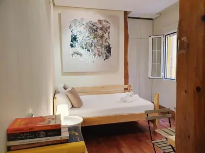 Cama o camas de una habitación en Enjoy a cosy studio in Malasaña BAR