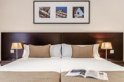 Cama o camas de una habitación en Exe Suites 33