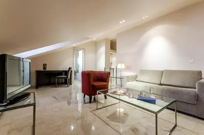 Zona de estar de Exe Suites 33