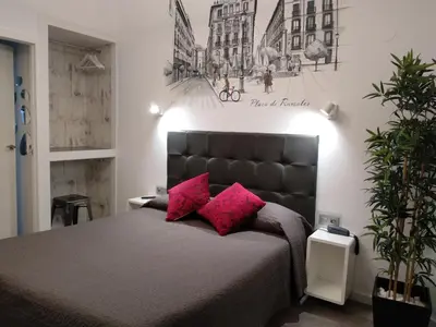 Cama o camas de una habitación en Hostal Lauria