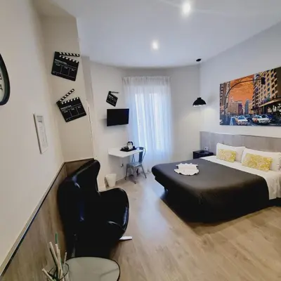 Cama o camas de una habitación en Hostal Lauria