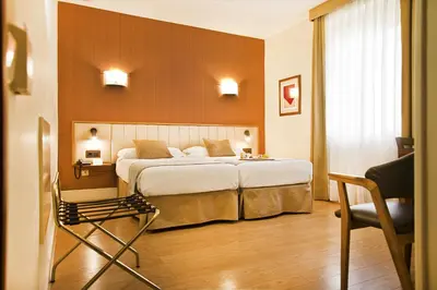 Cama o camas de una habitación en Hospedium Hotel Los Condes