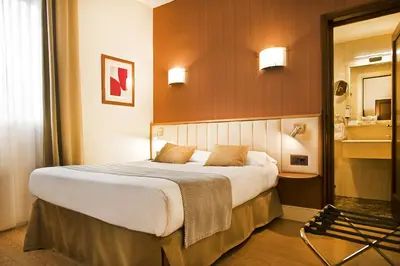 Cama o camas de una habitación en Hospedium Hotel Los Condes