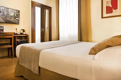 Cama o camas de una habitación en Hospedium Hotel Los Condes