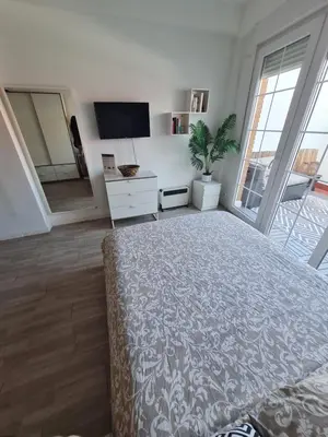 Una televisión o centro de entretenimiento en Espectacular Loft con terraza