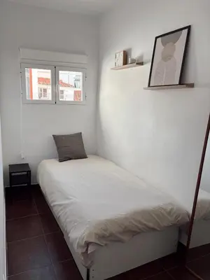 Cama o camas de una habitación en Piso Acogedor Malasaña