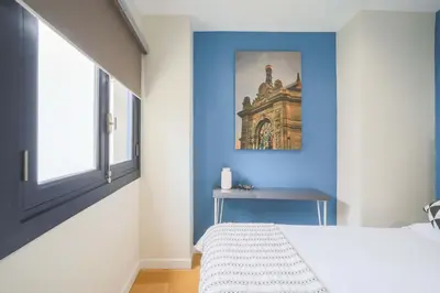 Cama o camas de una habitación en Housing Plaza Mayor by SharingCo