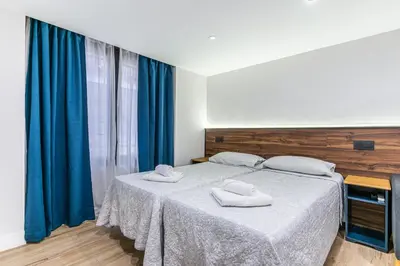 Cama o camas de una habitación en CC Atocha Apartments
