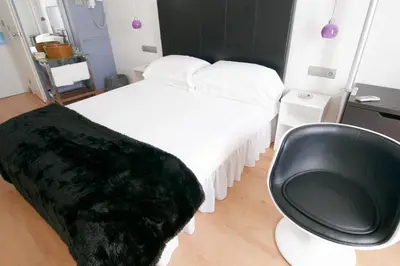 Cama o camas de una habitación en Hostal Santo Domingo