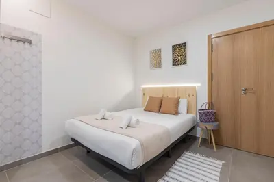 Cama o camas de una habitación en Dobo Madrid América