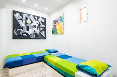 Cama o camas de una habitación en For You Rentals Teatro Real Plaza Apartment TEMPORAL Saint Martin Madrid TRU50