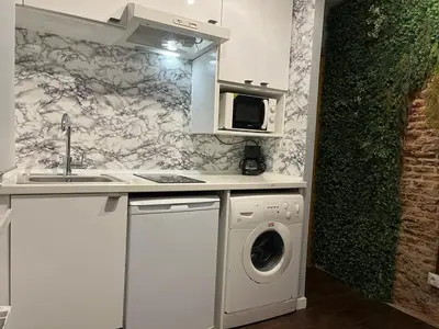 Una cocina o zona de cocina en Coqueto apartamento muy céntrico