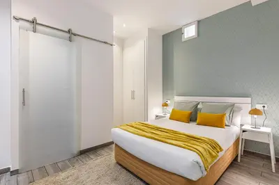 Cama o camas de una habitación en Waou Gran Via II - Alquiler Corta Duración