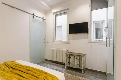 Cama o camas de una habitación en Waou Gran Via II - Alquiler Corta Duración