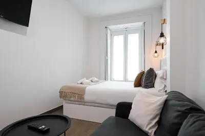 Cama o camas de una habitación en Apartamentos Fuencarral
