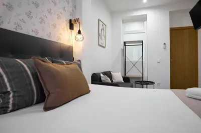 Cama o camas de una habitación en Apartamentos Fuencarral