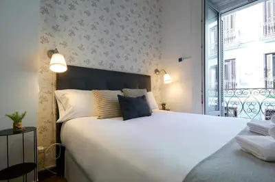 Cama o camas de una habitación en Apartamentos Fuencarral