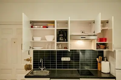 Una cocina o zona de cocina en MyHouseSpain - Moderno piso I en Chueca
