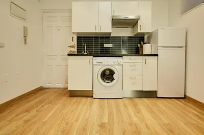Una cocina o zona de cocina en MyHouseSpain - Moderno piso I en Chueca