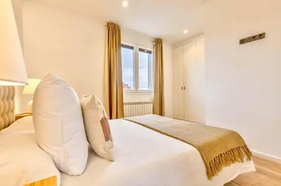 Cama o camas de una habitación en Luces en Madrid