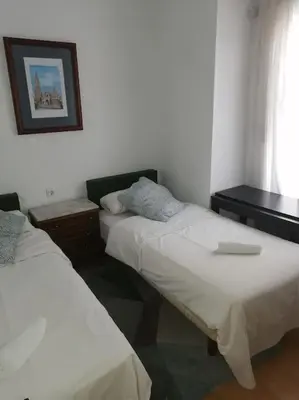 Cama o camas de una habitación en Apartamento HOTEL MONTAÑA LAVAPIES