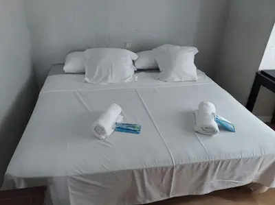 Cama o camas de una habitación en Apartamento HOTEL MONTAÑA LAVAPIES