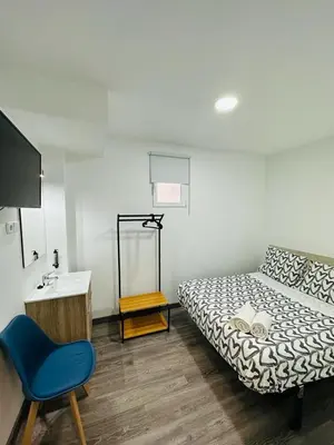 Cama o camas de una habitación en HOSPEDAJE NUEVA NUMANCIA