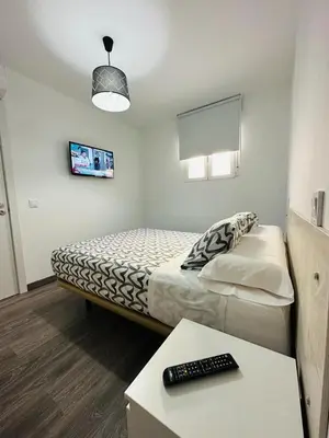 Cama o camas de una habitación en HOSPEDAJE NUEVA NUMANCIA