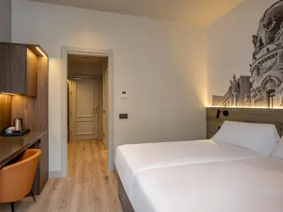 Cama o camas de una habitación en Regente Hotel