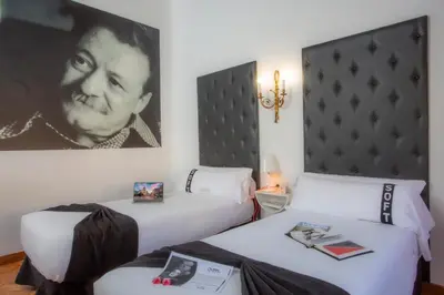 Cama o camas de una habitación en Casual del Teatro Madrid