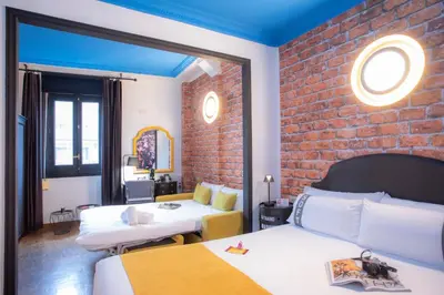 Cama o camas de una habitación en Casual del Teatro Madrid