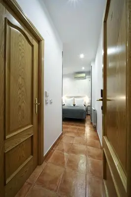 Cama o camas de una habitación en Hostal Las Fuentes