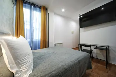 Cama o camas de una habitación en Hostal Las Fuentes
