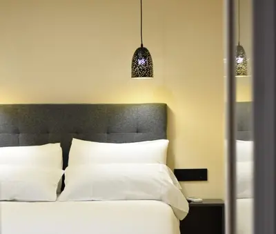 Cama o camas de una habitación en PACOROOMS