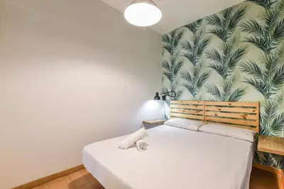 Cama o camas de una habitación en Acogedor piso Madrid Centro ALQUILER TEMPORAL